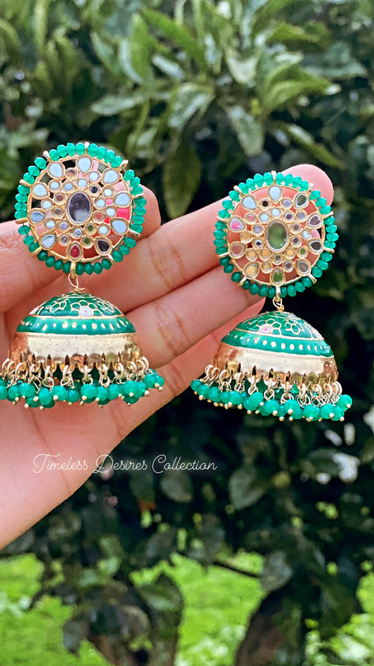 Green jhumka earrings in mirror