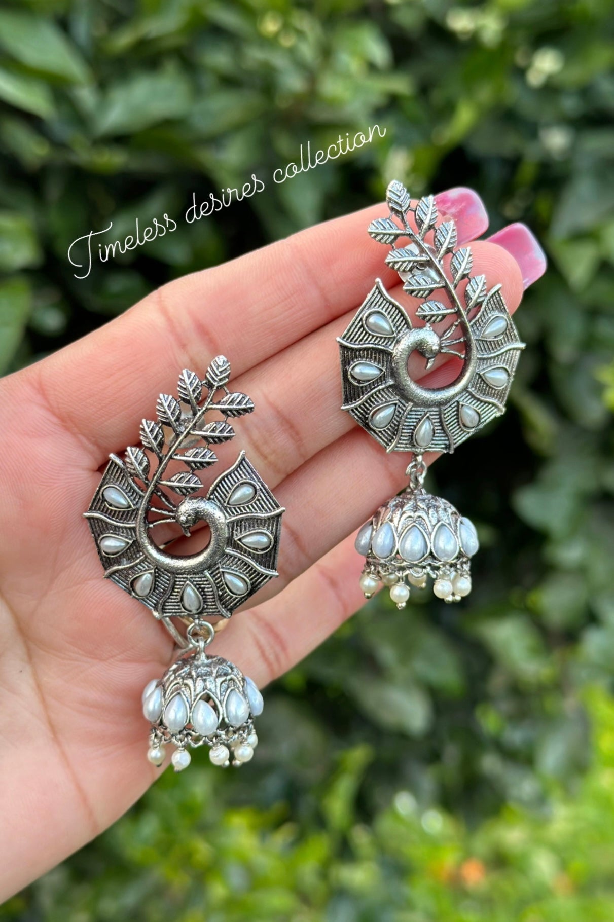 Silver look jhumka earrings in oxidised