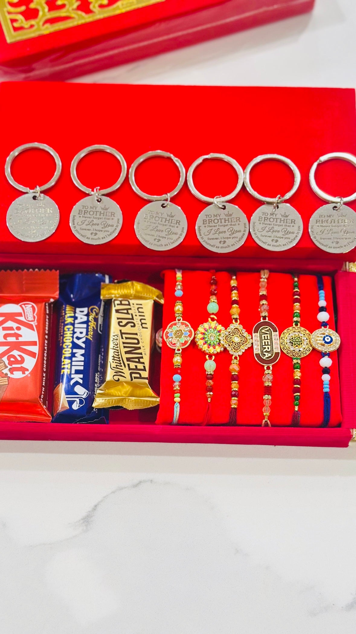 Family Rakhi Hamper bundle with Gifts - 6 Assorted Rakhdi + 6 Key Rings + Chocolates