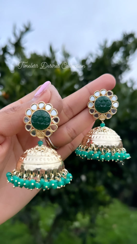 Green Jhumka Earrings in mirror