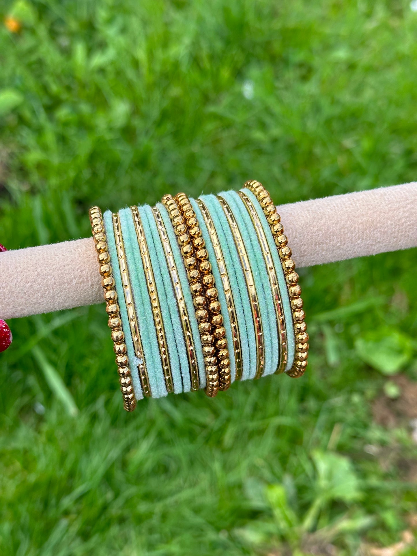 Pista or mint green velvet bangles set with golden beaded kangan’s