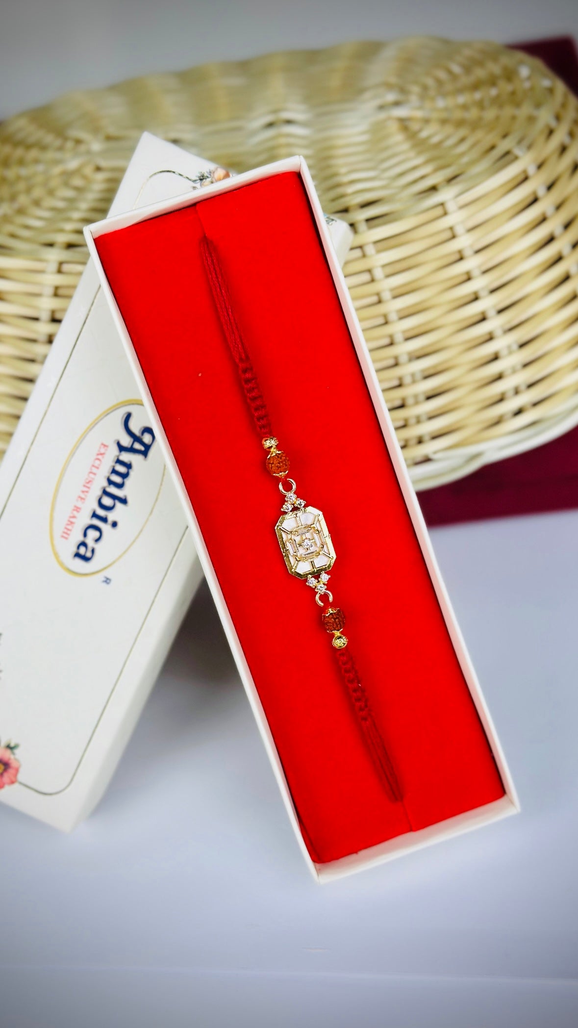 Mother of Pearl with Rudraksh Rakhi / Rakhdi Pack in American Diamond - Code A32