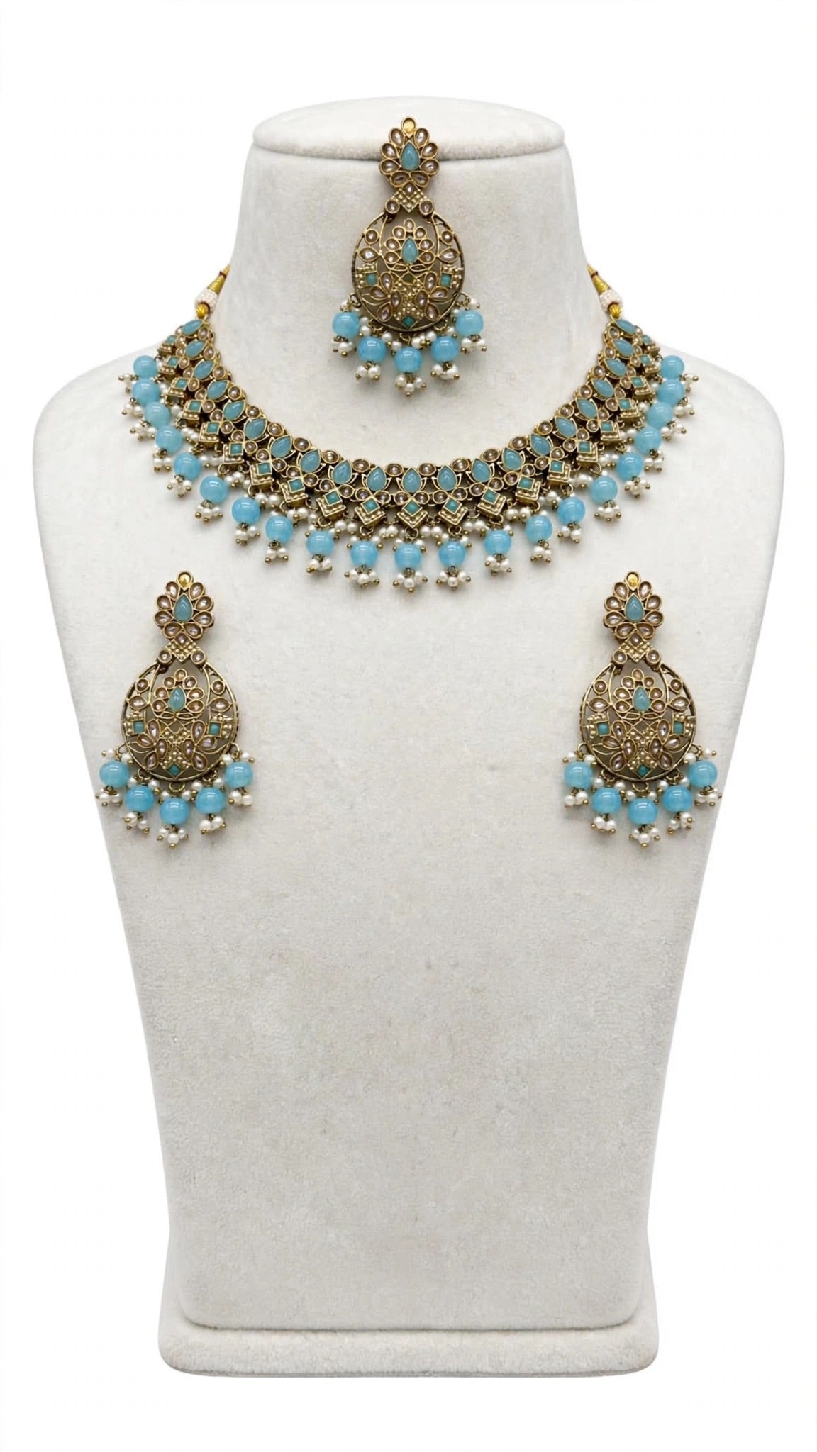 Necklace set with earrings and tikka