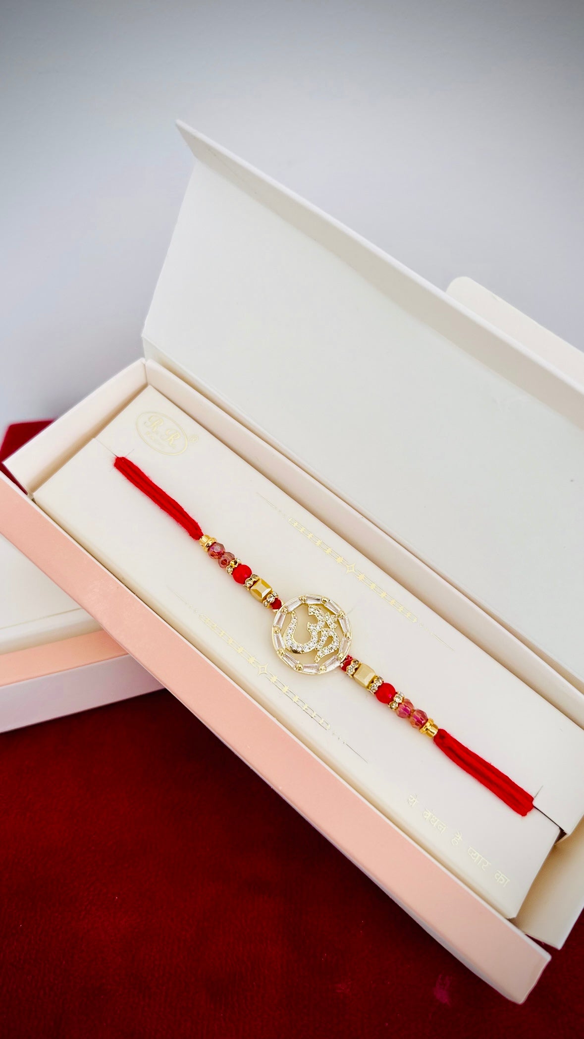 OM Rakhi / Rakhdi box in American Diamond- Code A11