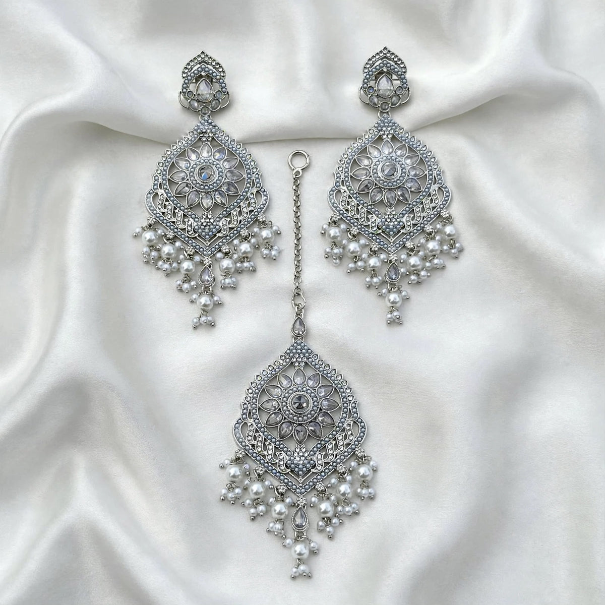 Silver earrings with tikka- J10