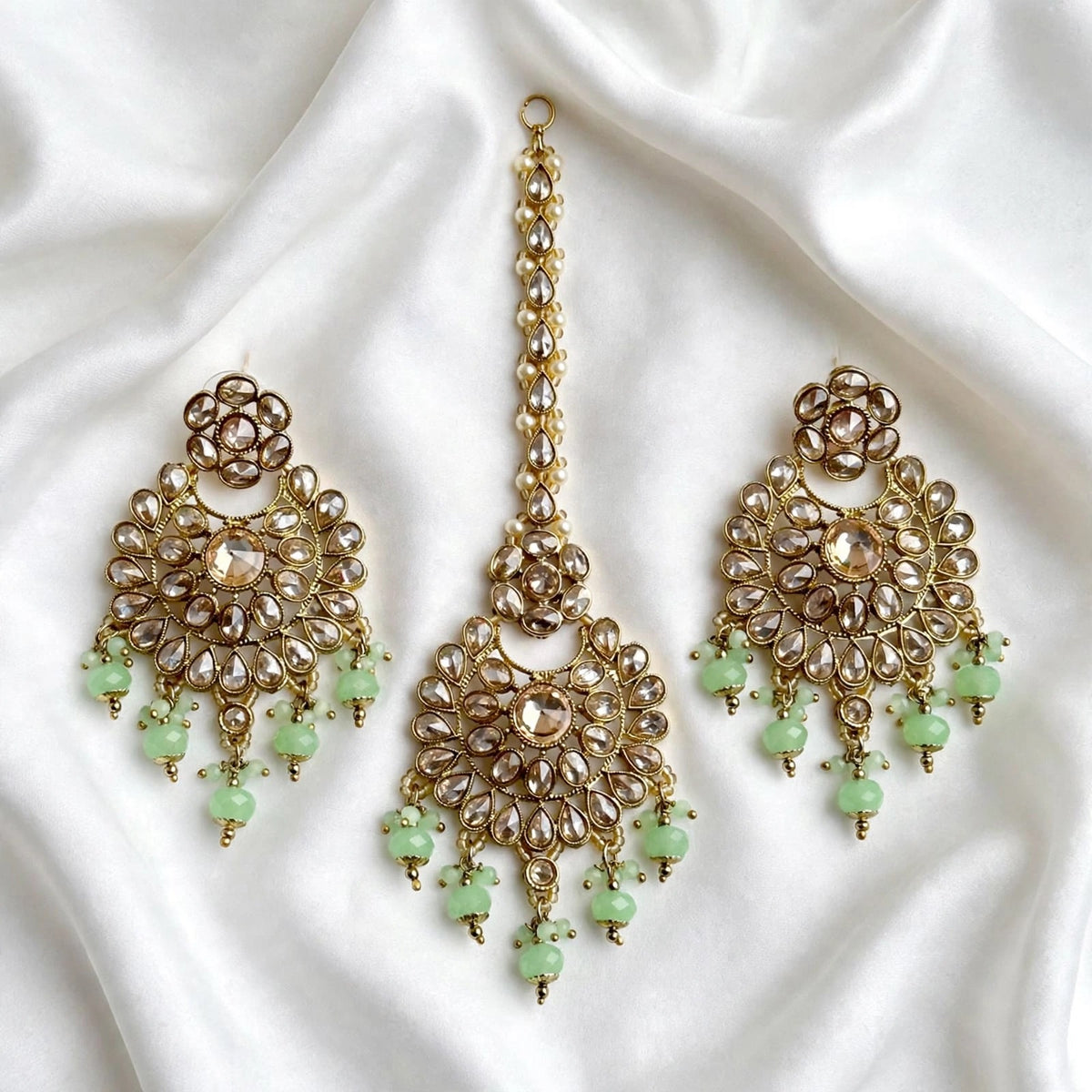 Mint  green earrings and tikka set in reverse AD ( high quality Polki )