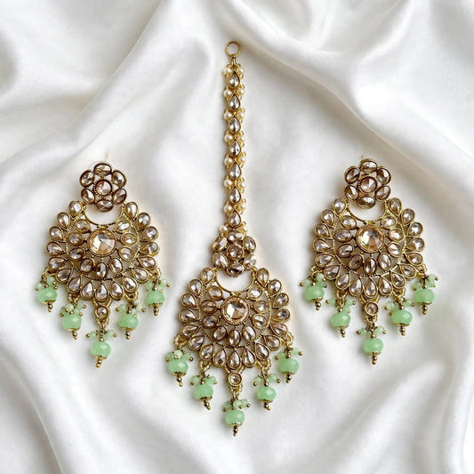 Mint  green earrings and tikka set in reverse AD ( high quality Polki )