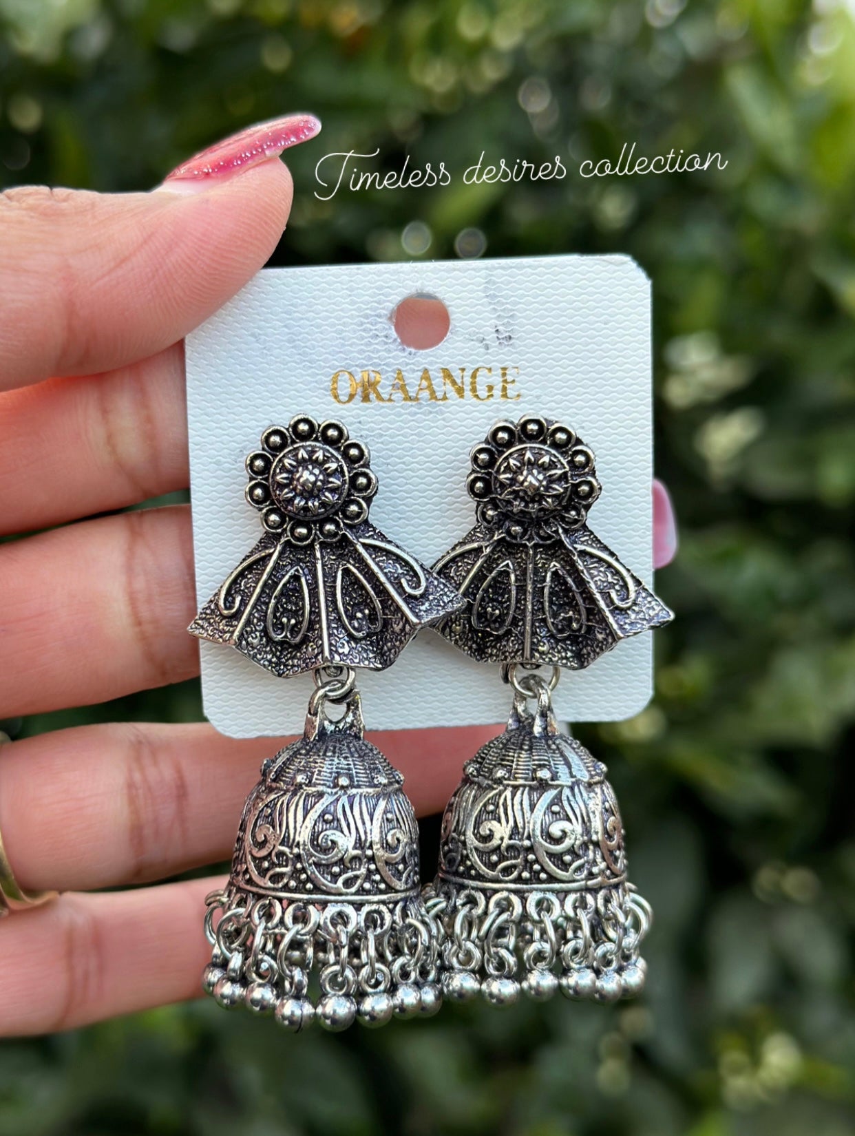 Silver look jhumka earrings in oxidised
