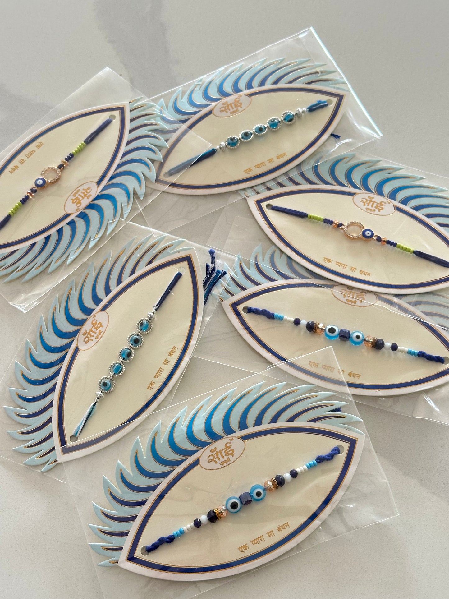 Evil Eye Rakhi / Rakhdi packs with assorted designs   ( per pc )