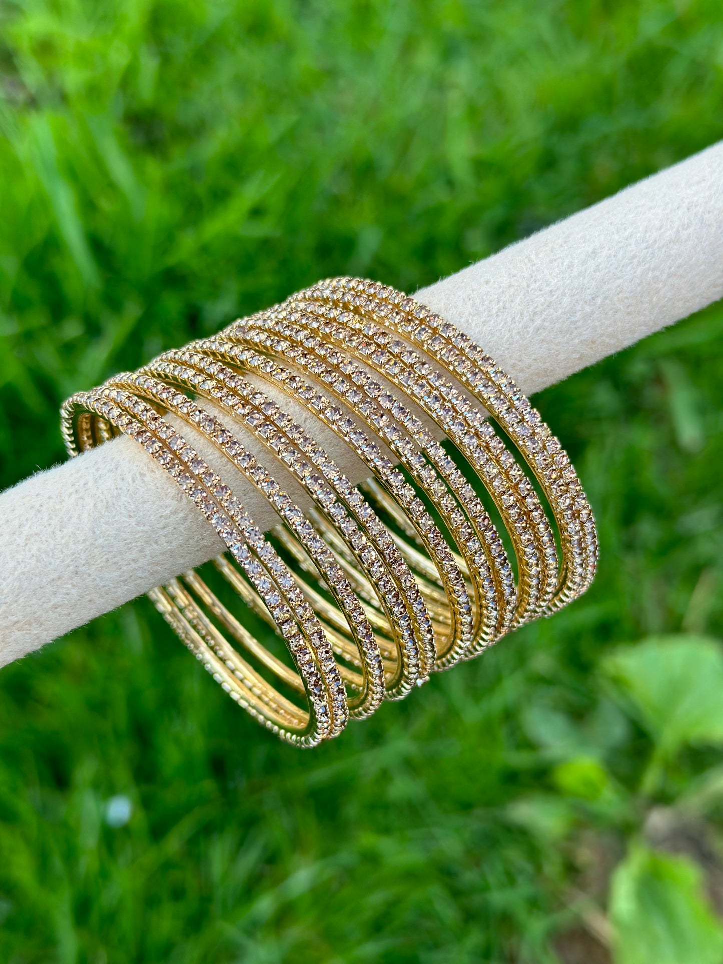 Sleek golden bangles with little diamonds
