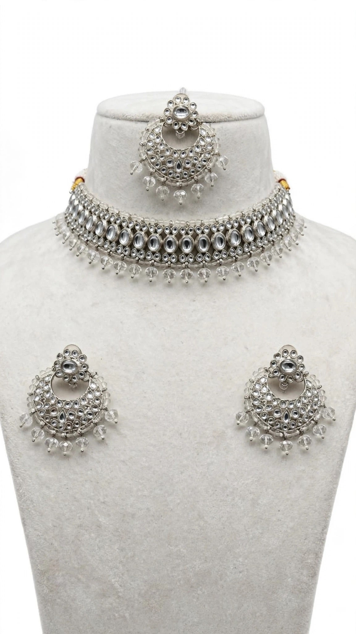 Necklace set with earrings and tikka
