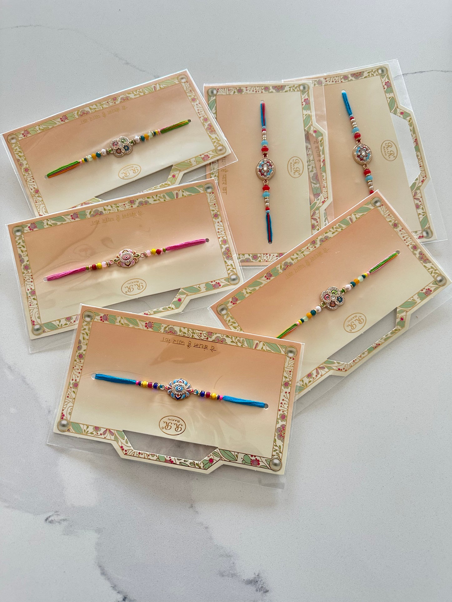 Assorted Rakhi / Rakhdi packs in Meenakari  ( per pack )