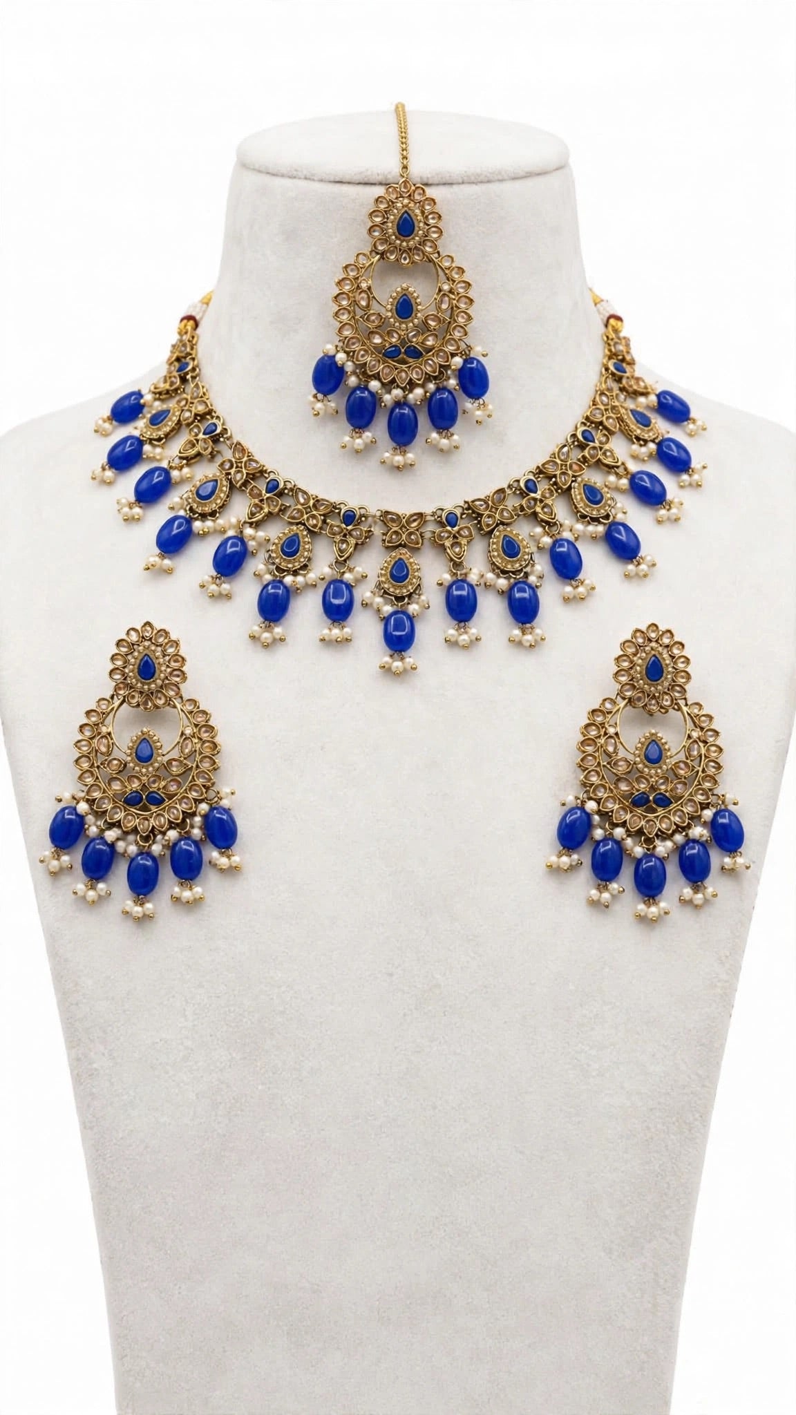 Necklace set with earrings and tikka