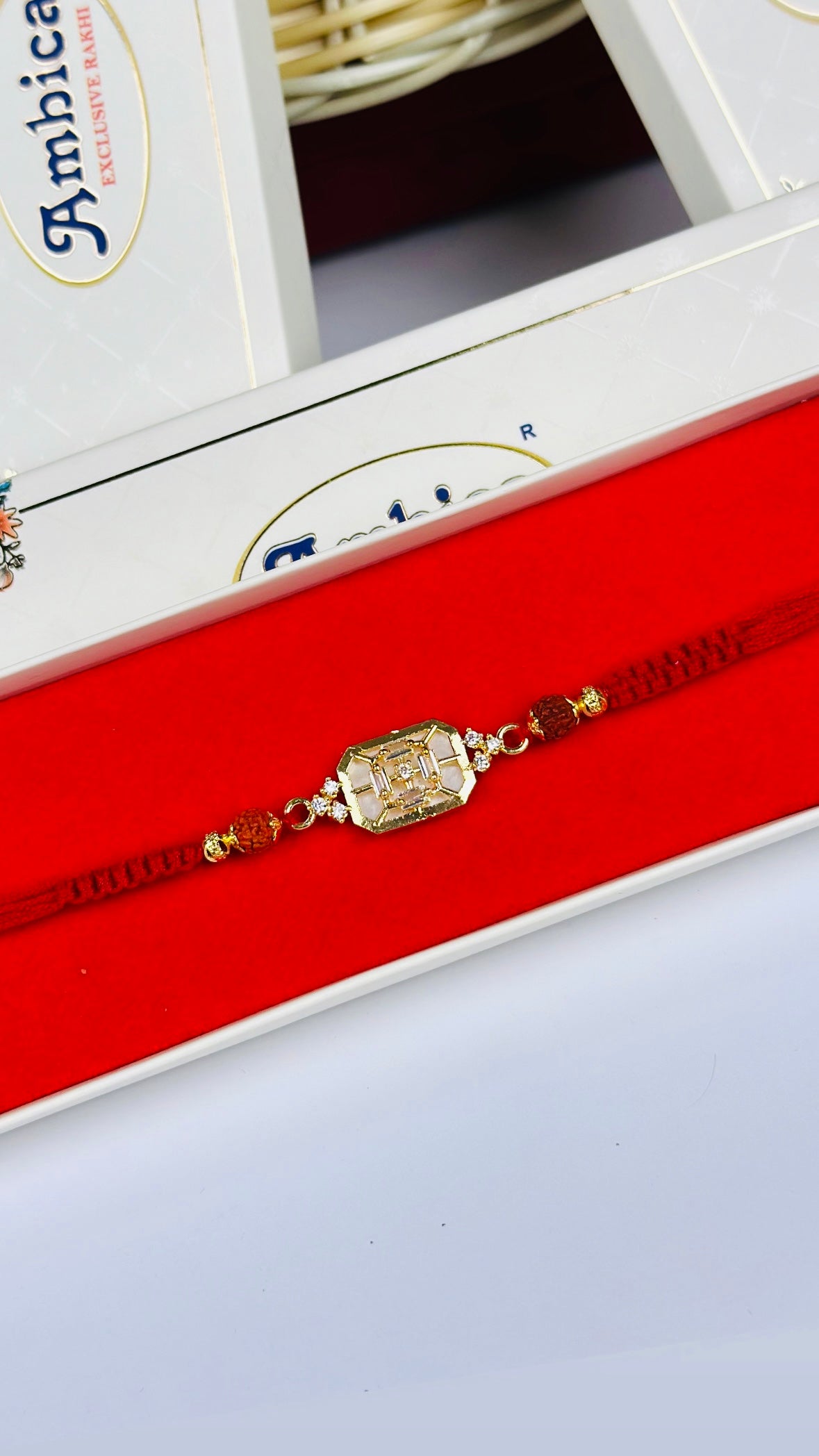 Mother of Pearl with Rudraksh Rakhi / Rakhdi Pack in American Diamond - Code A32
