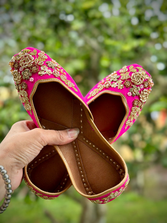 Punjabi jutti in pink colour with golden hand work