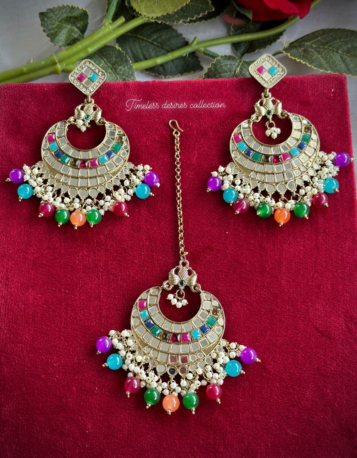 Multi coloured earrings and tikka set in mirror